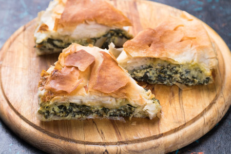 Spanakopita, greek phyllo pastry pie with spinach and feta cheese filling
