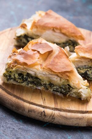 Spanakopita, greek phyllo pastry pie with spinach and feta cheese fillingの写真素材