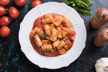 Gnocchi di patata, italian potato noodles in tomato sauceの写真素材
