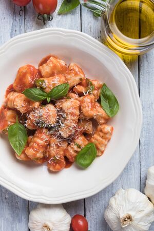 Gnocchi di patata, italian potato noodles in tomato sauceの写真素材