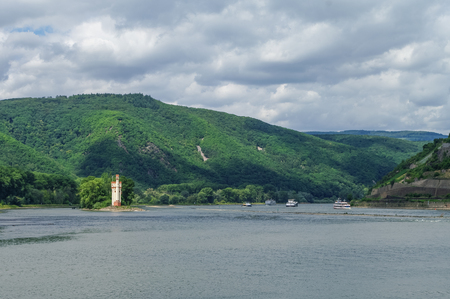 Ship, medieval castle Mouse Tower Museturm and vineyards on the slope of Rhine river bank, Bingen am Rhein, Germanyのeditorial素材