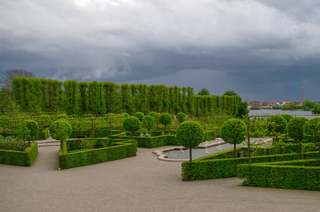 Hillerod, Denmark - 1 may 2011:Regular park of Frederiksborg Castle. Lawn trimmed in the form of monograms.のeditorial素材