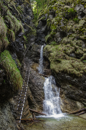 Dangerous trail  across waterfall  (using Via Ferrata), Slovak Paradise National Park,Slovakiaの写真素材
