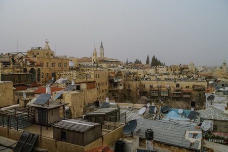 Walls and castle of old city. Jerusalem panoramic roof view in time of sand storm. Israel