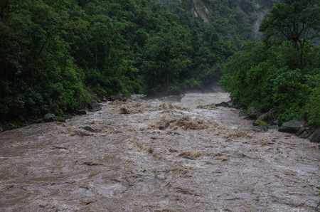 Rapids of Urubamba river near Aguas Calientes village after tropical rain, Peruの写真素材