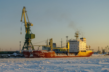 St. Petersburg, Russia - February 20, 2011: Ships and cranes in cargo port of St. Petersburg in winter time, covered by ice and snowのeditorial素材