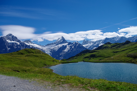Sunny day view to the mountains Bachalpsee lake. Mannlichen (Jungfrau region, Bern, Switzerland)の写真素材