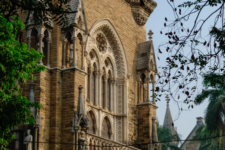 Mumbai, India - January 1, 2012:  Details of Rajabai Clock Tower, Heritage building, University of Mumbai campus, Mumbai, Maharashtra, India, Southeast Asia.のeditorial素材