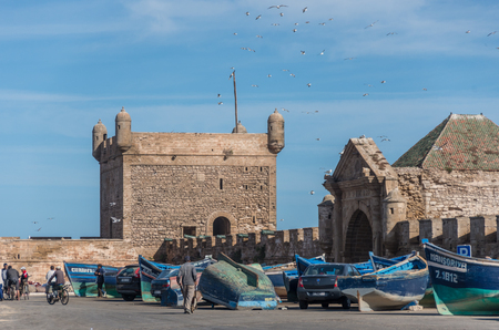 Essaouira, Morocco - May  6, 2017 : Fishing boats on background of Castelo Real of Mogador and Scala du Port ( Northern Skala ). Essaouira, Moroccoのeditorial素材