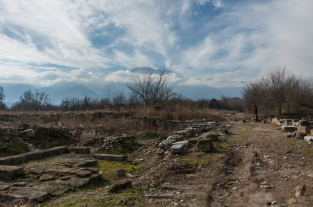 Ruins of building at Dion archaeological site with  mountain at background. Pieria, Macedonia, Greeceのeditorial素材