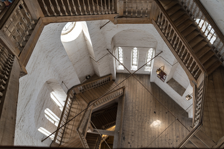 Vologda, Russia - July 28, 2019:   Wooden staircase in Bell tower of Sophia cathedral, in Vologda Kremlin. Museum of regional. Vologda, Russia.のeditorial素材
