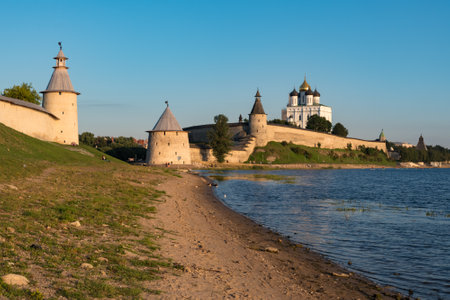 Pskov Kremlin Russia view from river Pskova creek. Towers, wall and Trinity cathedral on background.のeditorial素材