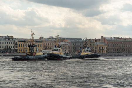 St. Petersburg, Russia - May 2, 2021: Harbor tugs perform the Tug Waltz show during the Icebreaker Festival on the Neva Riverのeditorial素材