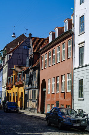 Copenhagen, Denmark - 2 May 2011: Famous narrow street with colorful buildings in Copenhagen's old...