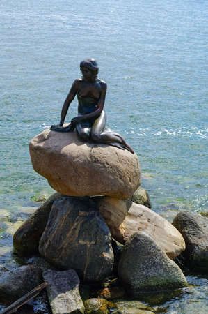 Copenhagen, Denmark - 30 April 2011: The Little Mermaid, Den lille Havfrue, a bronze statue by Edvard Eriksen, the sculpture is displayed on a rock by the waterside at the Langelinie promenade.のeditorial素材