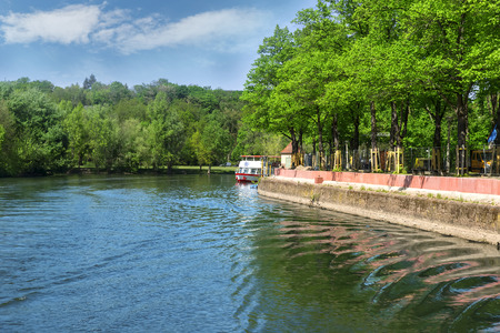 Flow of a wide river with picturesque shores and interesting detailsの写真素材