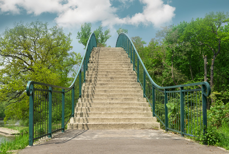 Stone staircase with iron railing looking to the skyの写真素材