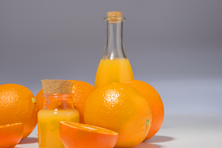 Beautiful fresh oranges and utensils, isolated on white backgroundの写真素材