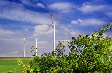Production of alternative energy, solar panels and wind generators, in summerの写真素材