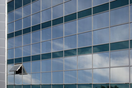 open window on glass fasade of office building