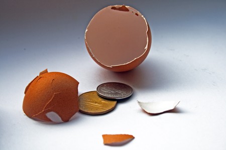 Finance/Investment Concept/Several CANADIAN coins are being hatched from an egg shell.の写真素材