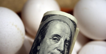roll of dollars  with eggs