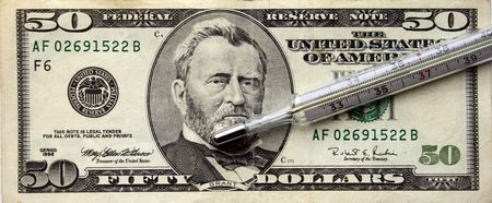 Health of economy, the thermometer on a background of a 50-dollar banknoteの写真素材