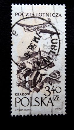 A stamp printed by Poland shows a jet above earth, one stamp from series circa 1950s.の写真素材