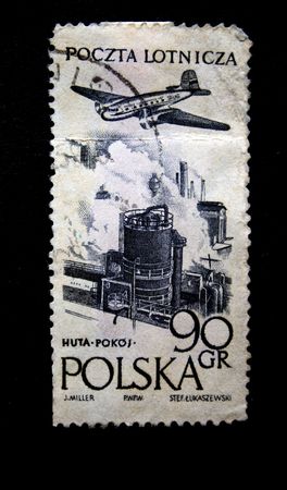A stamp printed by Poland shows a jet above earth, one stamp from series circa 1950s.の写真素材