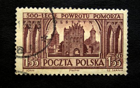 A stamp printed in Poland devoted Five hundred anniversary from the date of returning from Pomorze shows  view of  Olsztyn circa 1950s の写真素材