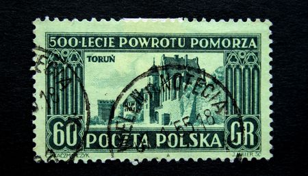 A stamp printed in Poland devoted Five hundred anniversary from the date of returning from Pomorze shows  view of  Torun circa 1950s の写真素材