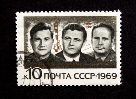 A stamp printed in the USSR show cosmonauts Cosmonauts Philipchenko, Volkov, Gorbatko, one stamp from series, circa 1969の写真素材