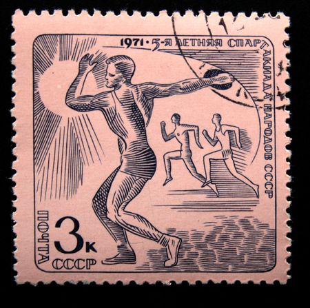 A stamp printed in the USSR shows Track and field athletics, one stamp from series devoted Summer Games of people of the USSR, circa 1971の写真素材