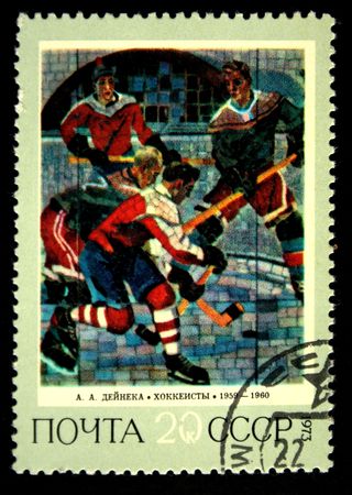 A stamp prunted in the USSR shows paint "Hockey players" by artist Alexander Deyneka, circa 1973のeditorial素材