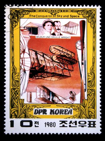 A stamp printed in DRK Korea (North Korea) shows Wright brothers and their plane, one stam from series The Conqueror of Sky and Space, circa 1980の写真素材