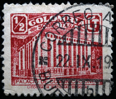 A stamp printed in Colombia shows Palace of Communicationsの写真素材