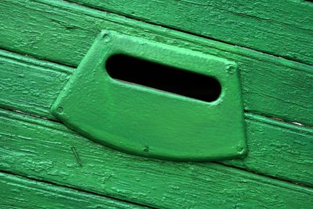 Mail box slot on the old grungy door in Russiaの写真素材