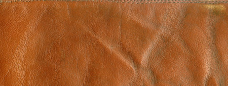 Close-up brown leather texture to background