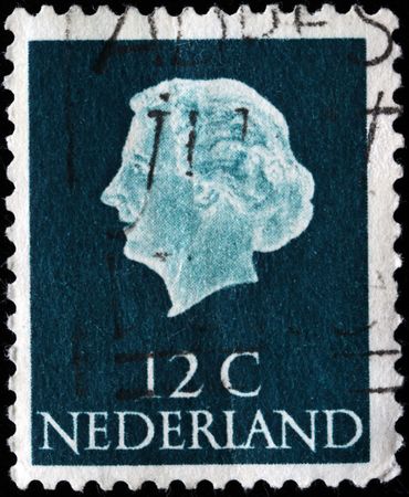 NETHERLANDS - CIRCA 1954: A stamp printed in the Netherlands shows image of Queen Juliana, series, circa 1954 のeditorial素材