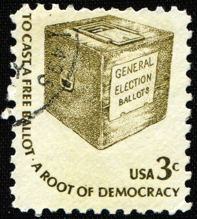 UNITED STATES OF AMERICA - CIRCA 1977: A stamp printed in the USA shows a ballot box and the wording の写真素材
