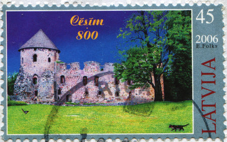 LATVIA - CIRCA 2006: A post stamp printed in Latvia shows Cesis Castle, circa 2006の写真素材