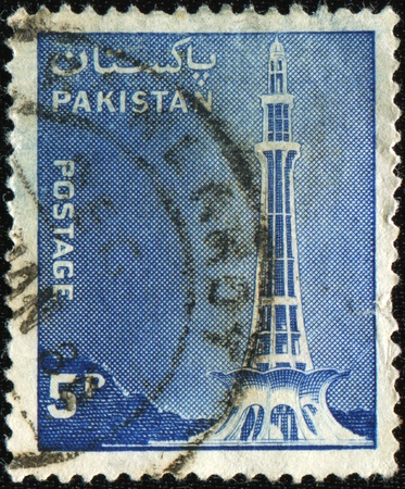 PAKISTAN - CIRCA 1978: A stamp printed in Pakistan shows Minar-e-Pakistan (Pakistan Day Memorial), Tractor and Mausoleum of Ibrahim Khan Makli, Tahtta, circa 1978の写真素材