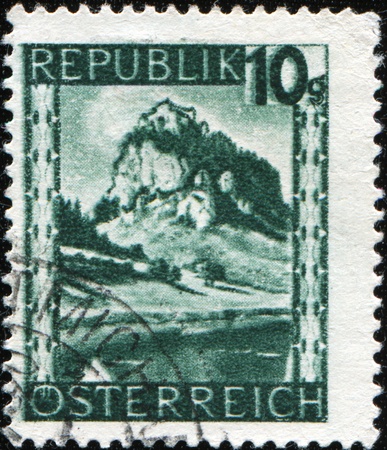 AUSTRIA - CIRCA 1947: A stamp printed in Austria showing Gschollkopf (2039m) of the Erfurt hut (1831m) seen, circa 1947 の写真素材