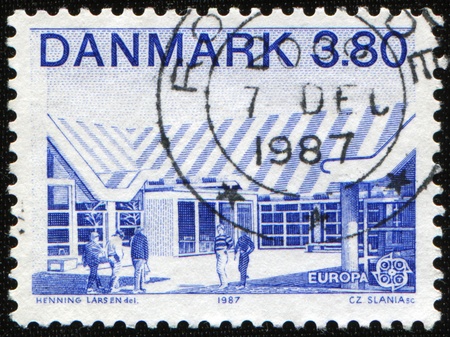 DENMARK - CIRCA 1987: A stamp printed in Denmark shows peoples near office building, circa 1987の写真素材
