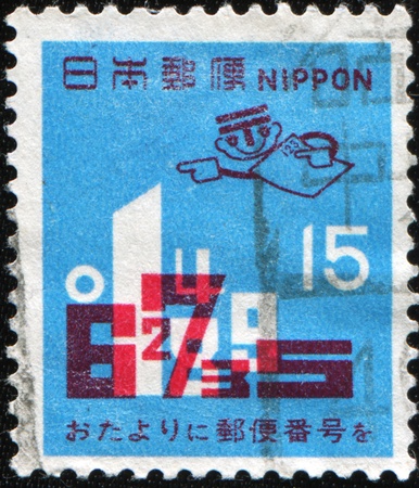 JAPAN - CIRCA 1971: A stamp printed in Japan shows arabic numeros postal index, circa 1971の写真素材