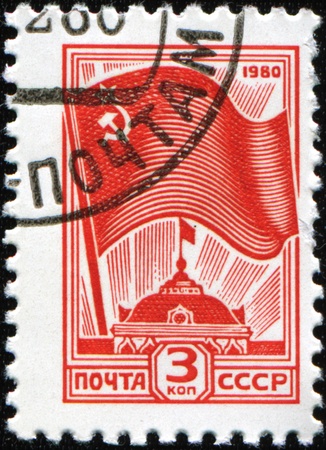 USSR - CIRCA 1980: A Stamp printed in USSR shows the Governmental flag over Moskow Kremlin, circa 1980 の写真素材