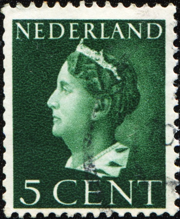 NETHERLANDS - CIRCA 1947: A stamp printed in the Netherlands shows Queen Wilhelmina, series, circa 1947 のeditorial素材