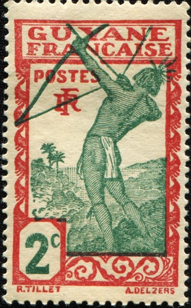 FRENCH GUIANA - CIRCA 1929: A stamp printed in French Guiana show Caribean archer, circa 1929の写真素材