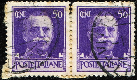 ITALY - CIRCA 1943: A stamp printed in Italy shows image of King Victor Emmanuel III of Italy, circa 1943のeditorial素材