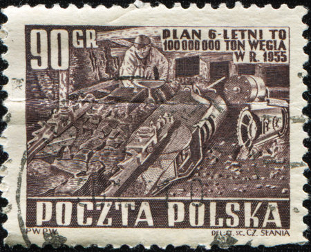 POLAND - CIRCA 1955: A stamp printed in Poland shows worker in coal mine, circa 1955の写真素材